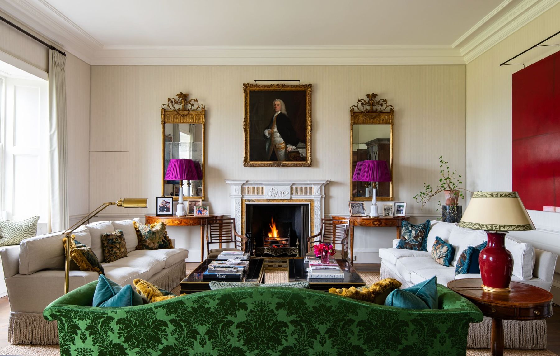 The drawing room, with a green velvet sofa before the fireplace