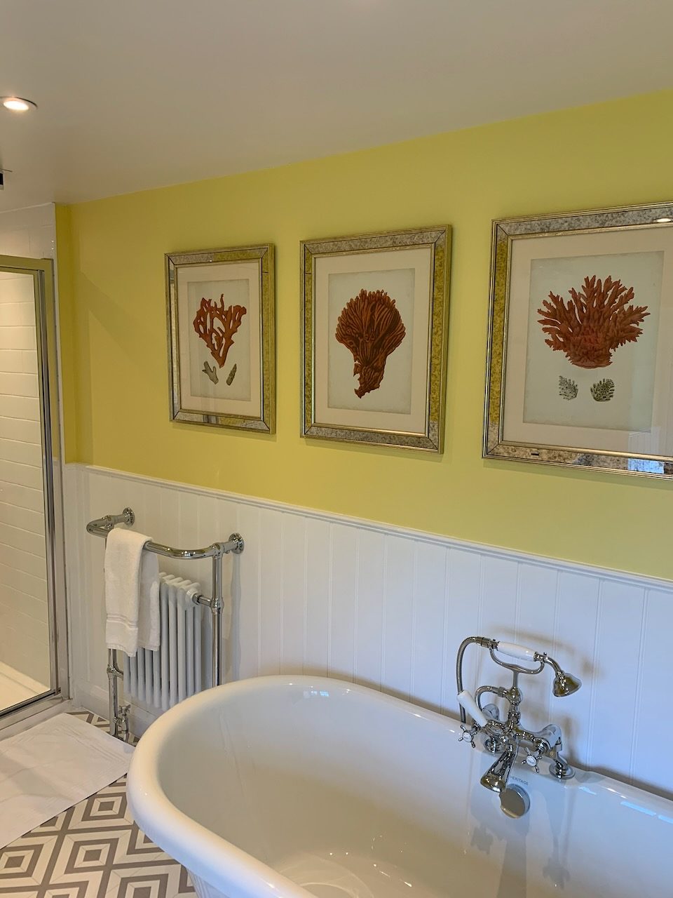 The bathroom, with a roll-top bath and pressed seaweed prints